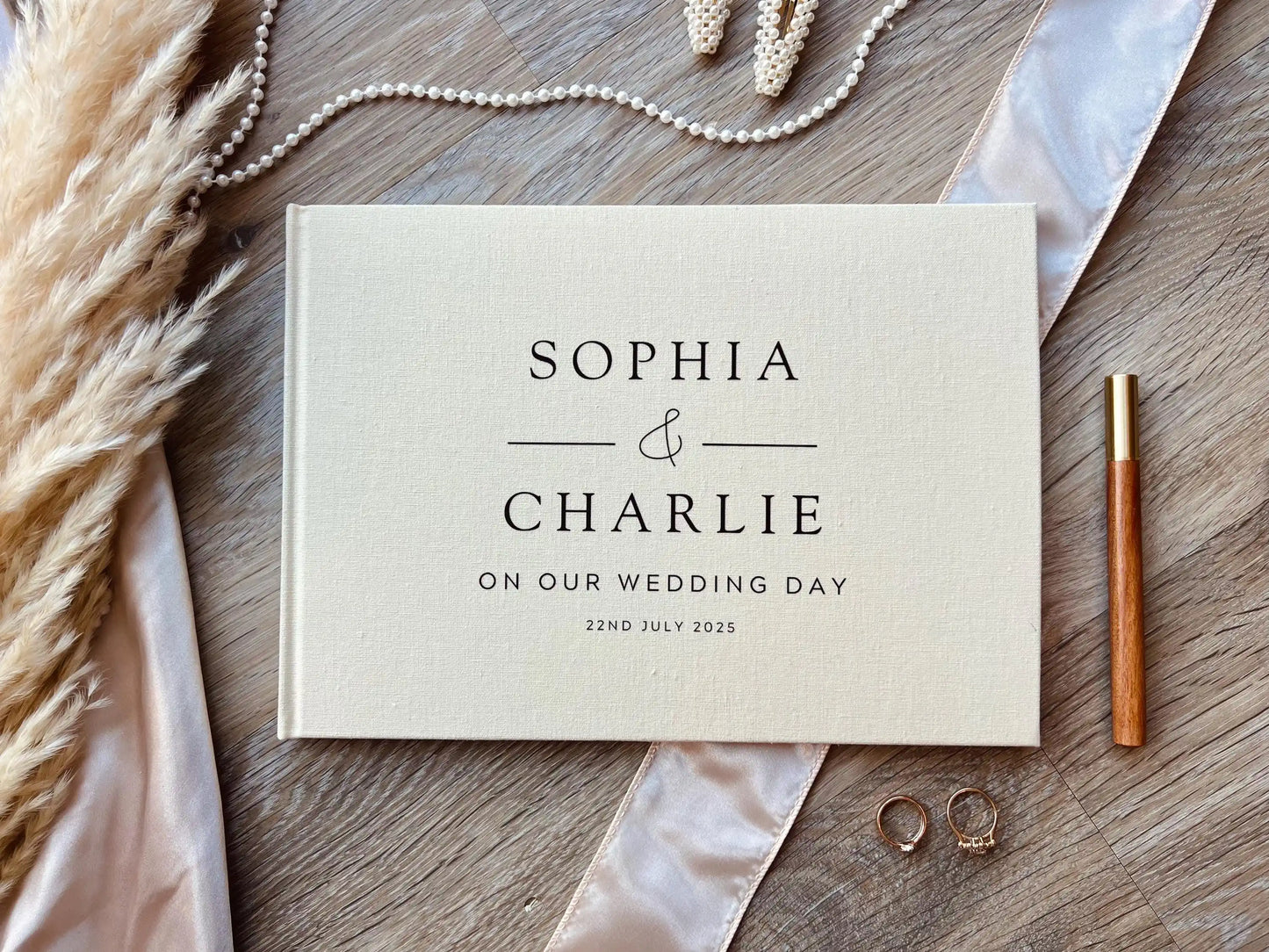 The Emerald Embossed Linen Guestbook - A beautifully crafted linen guestbook with embossed detailing for couples who want something truly special.