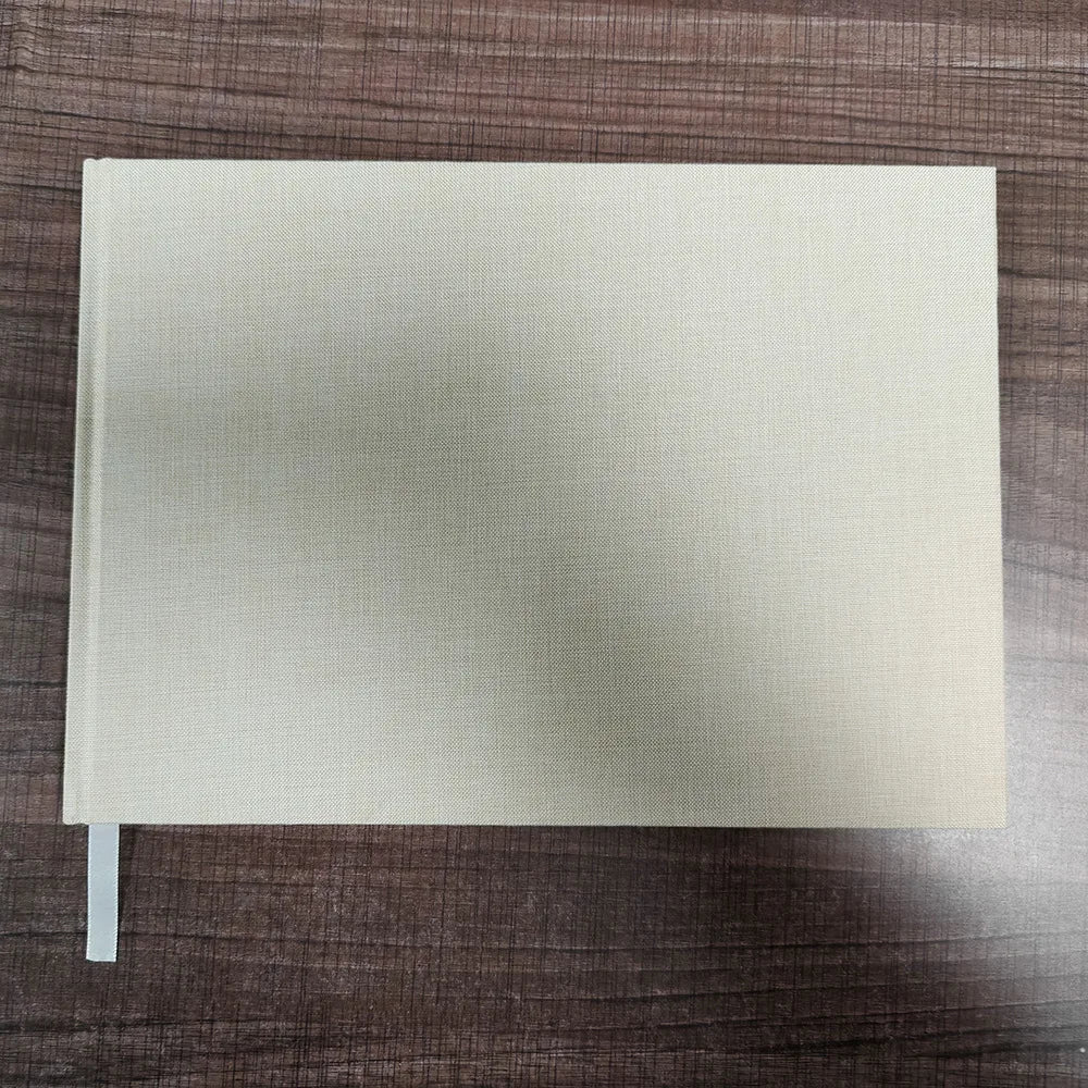 The Emerald Embossed Linen Guestbook - A beautifully crafted linen guestbook with embossed detailing for couples who want something truly special.